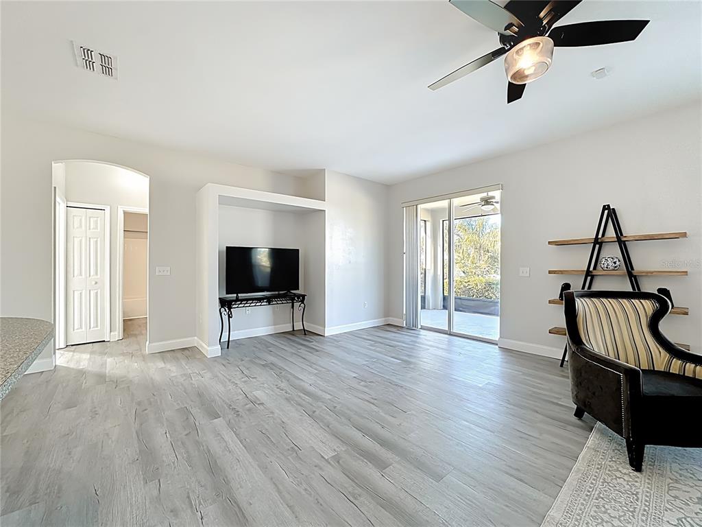 312 Towhee Road Winter Haven, FL 33881 - Photo 9 of 45 a living room with furniture and a flat screen tv