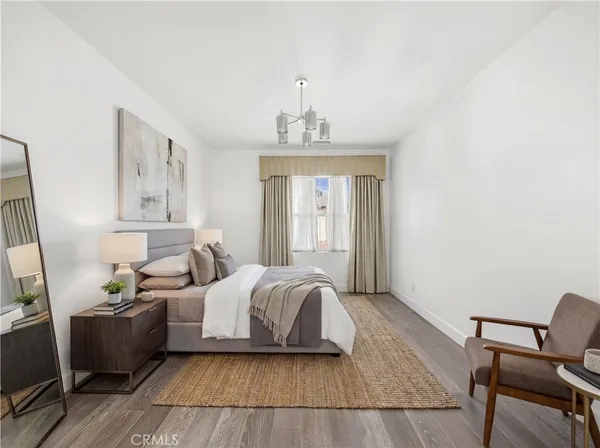 a bedroom with bed and window