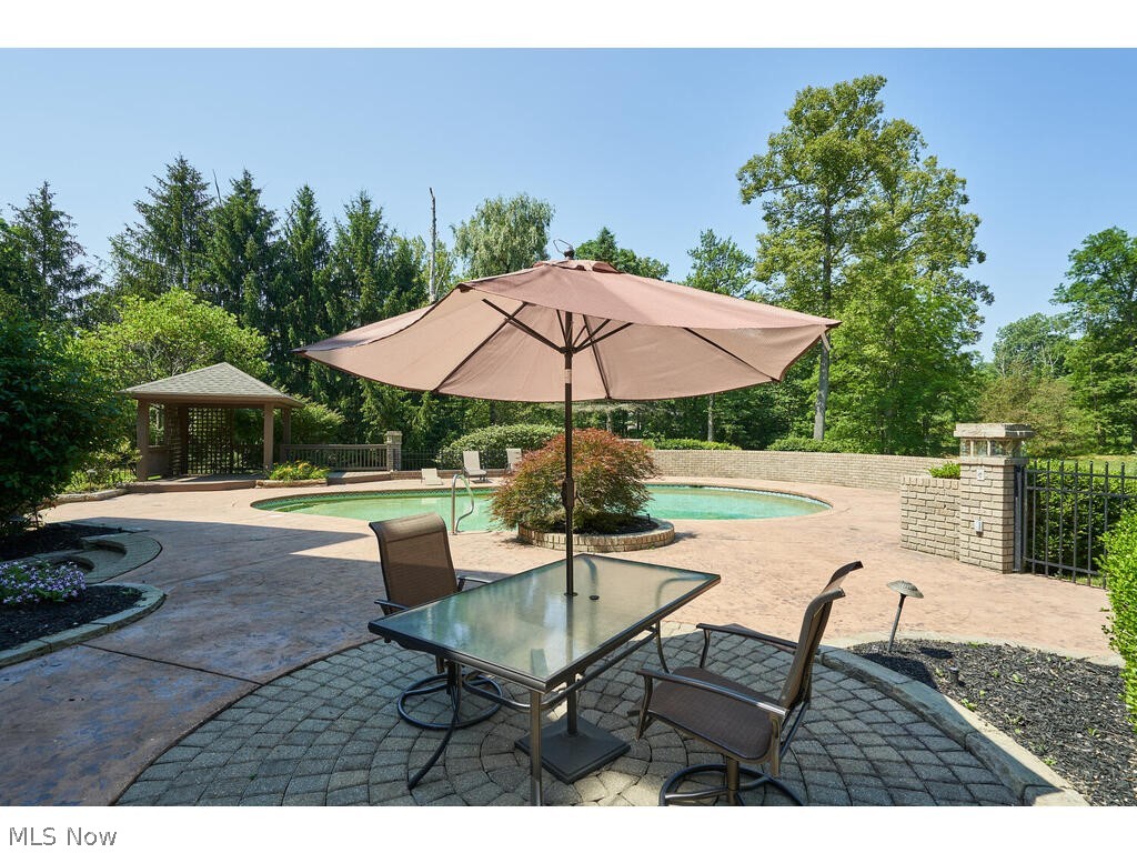 7786 Valley View Road Hudson, OH 44236 - Photo 42 of 50 View of terrace with a fenced in pool