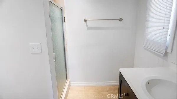a bathroom with a sink and shower