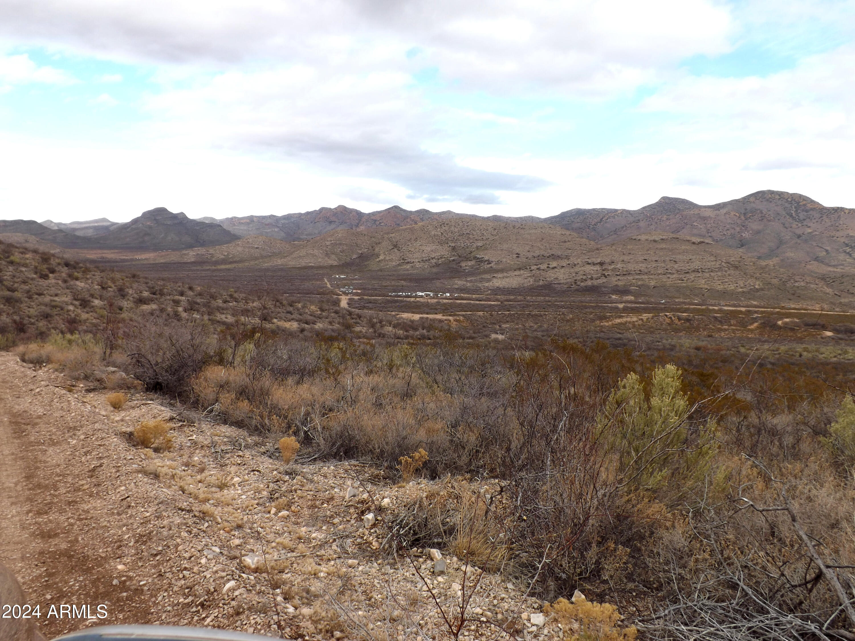 Lot 2 West Red Mountain Road, Unit 2 Bisbee, AZ 85603 - Photo 12 of 14 a view of a dry yard with mountains in the background