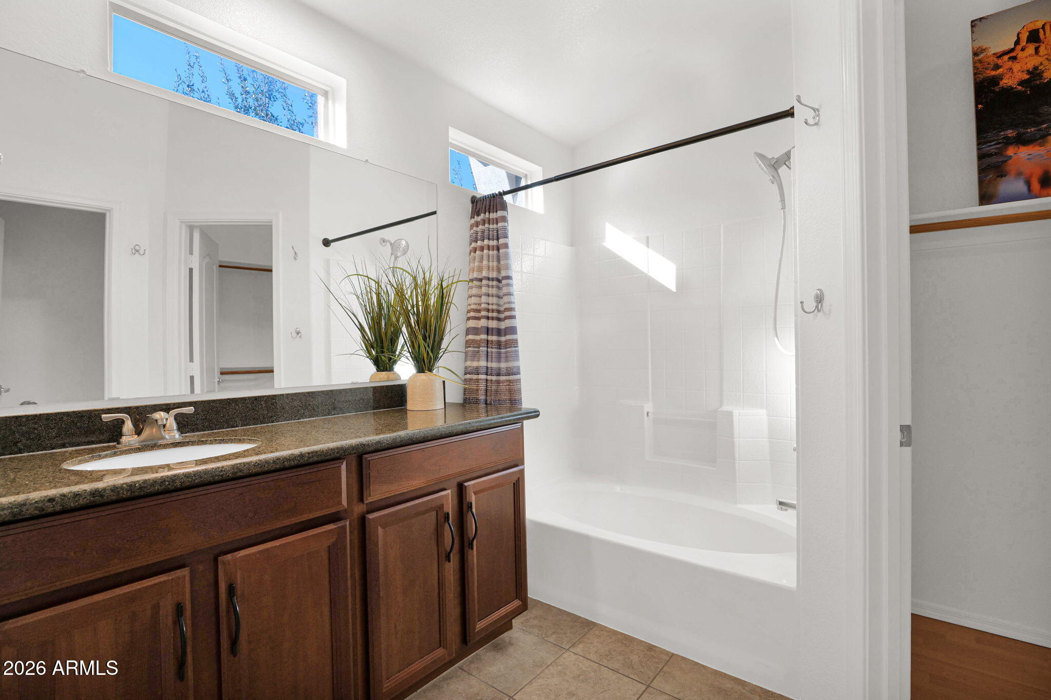 2402 East 5th Street, Unit 1646 Tempe, AZ 85288 - Photo 14 of 37 a bathroom with a double vanity sink and a bathtub