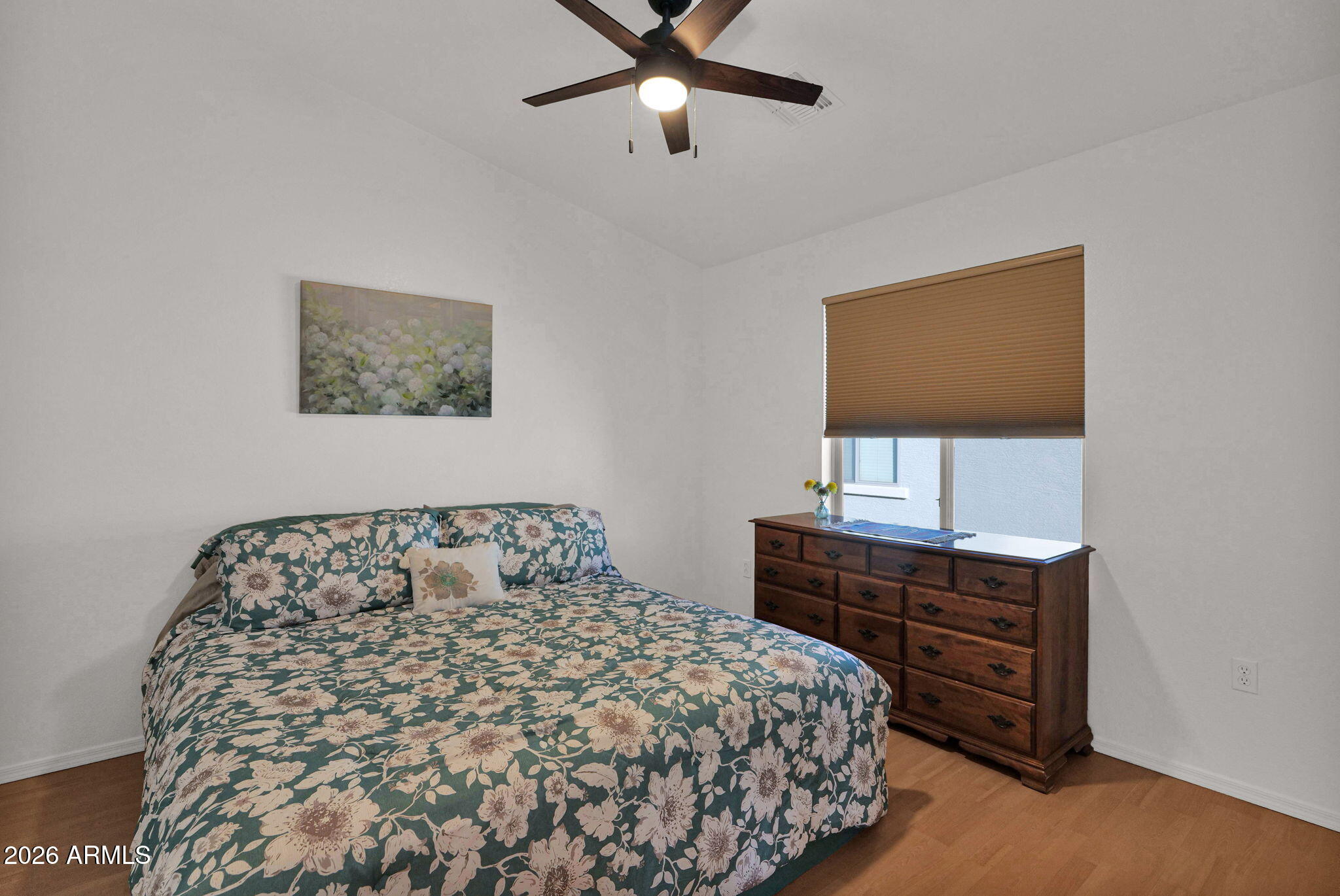 2402 East 5th Street, Unit 1646 Tempe, AZ 85288 - Photo 16 of 37 a bedroom with a bed and cabinet