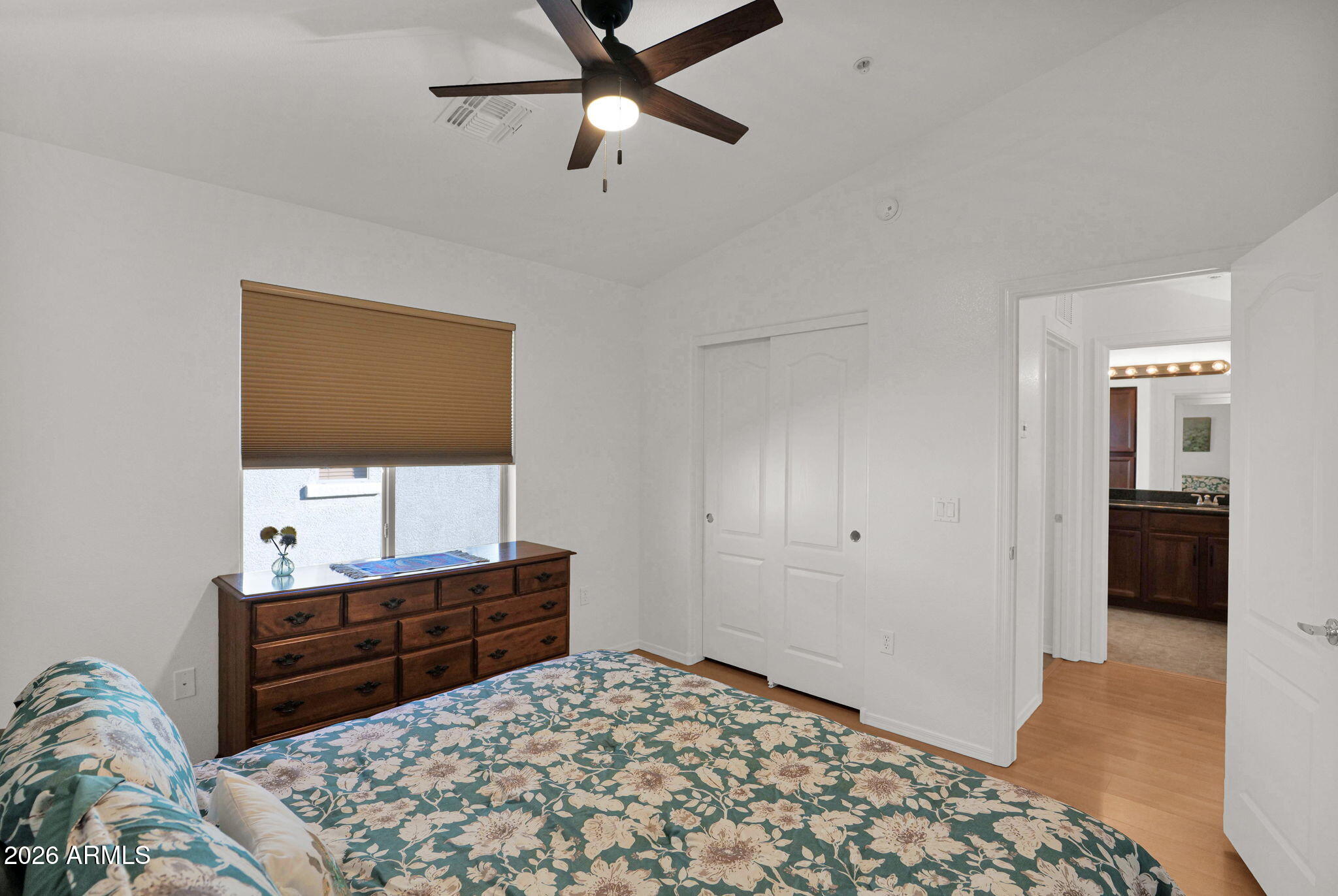 2402 East 5th Street, Unit 1646 Tempe, AZ 85288 - Photo 17 of 37 a bedroom with a bed and a dresser