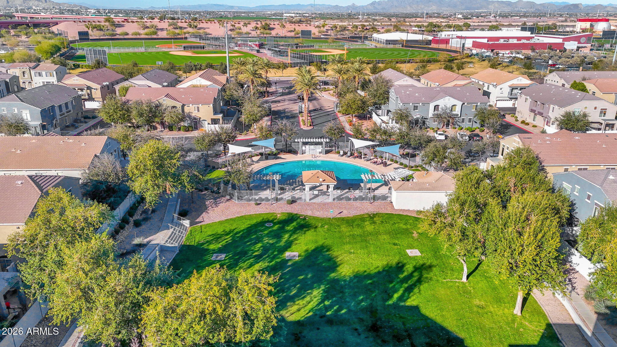 2402 East 5th Street, Unit 1646 Tempe, AZ 85288 - Photo 26 of 37 an aerial view of residential houses with outdoor space and swimming pool