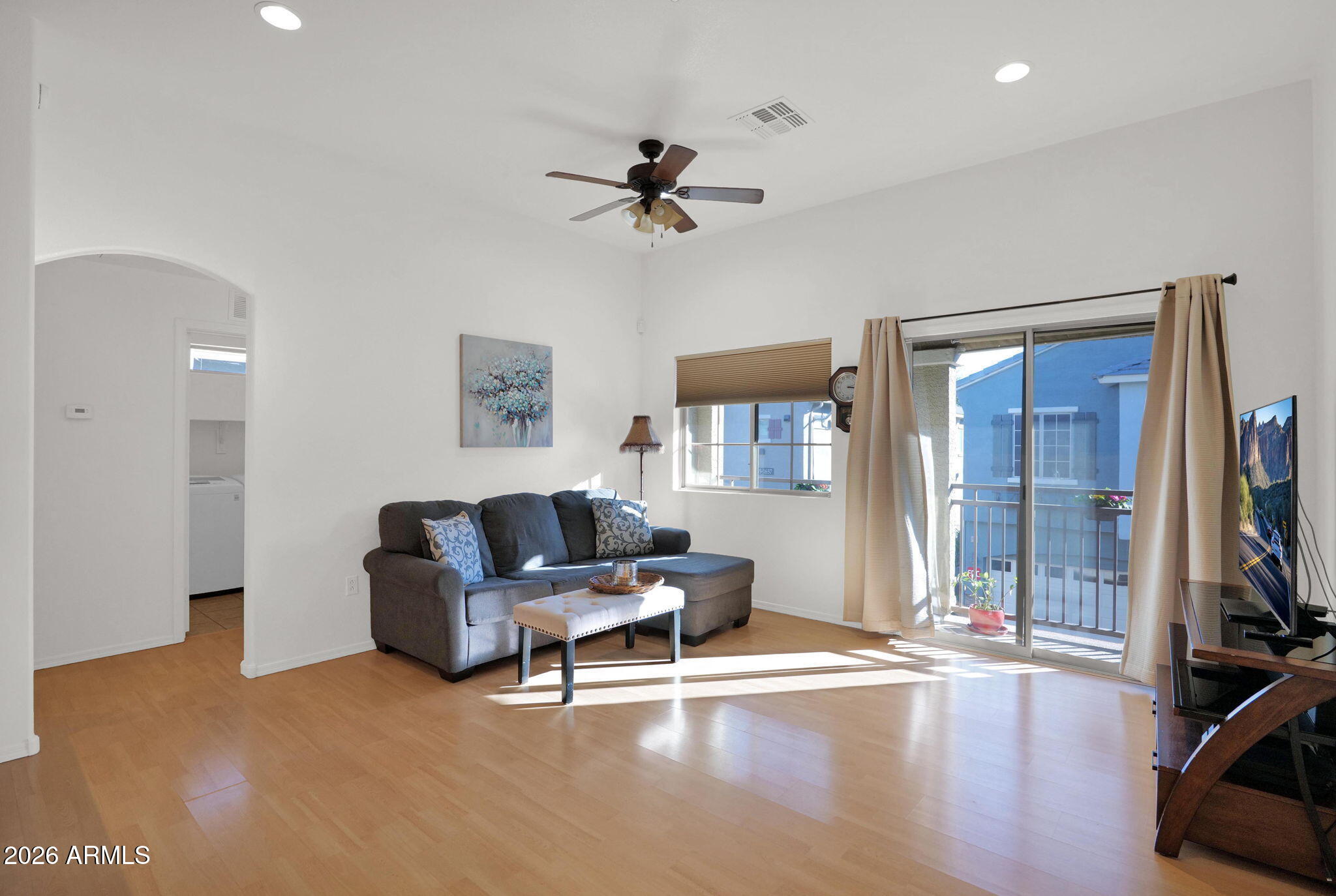 2402 East 5th Street, Unit 1646 Tempe, AZ 85288 - Photo 4 of 37 a living room with furniture and a flat screen tv