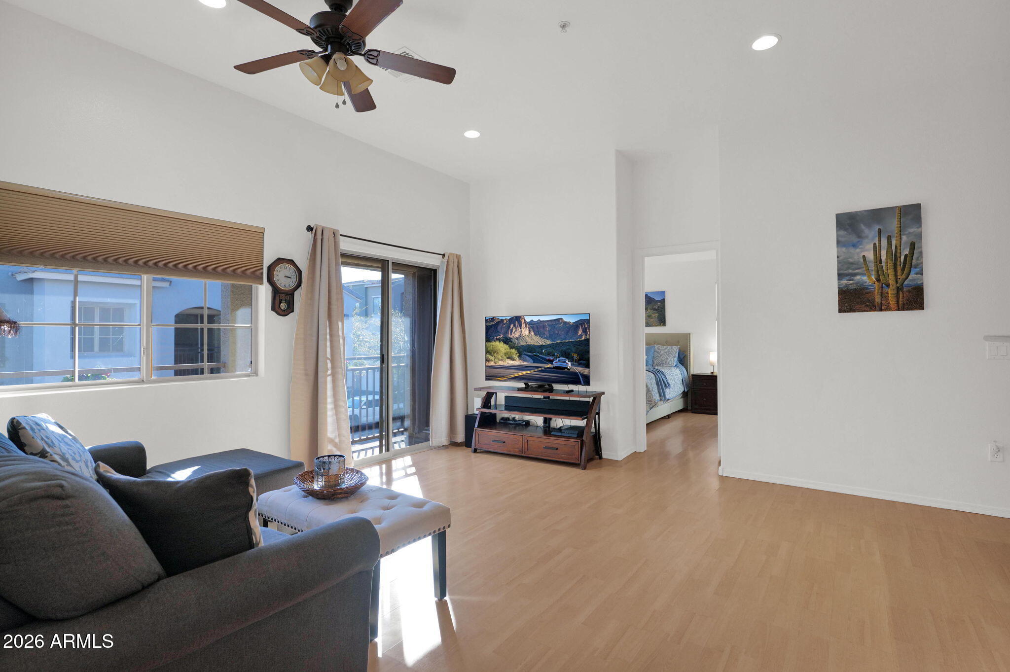 2402 East 5th Street, Unit 1646 Tempe, AZ 85288 - Photo 5 of 37 a living room with furniture and a flat screen tv