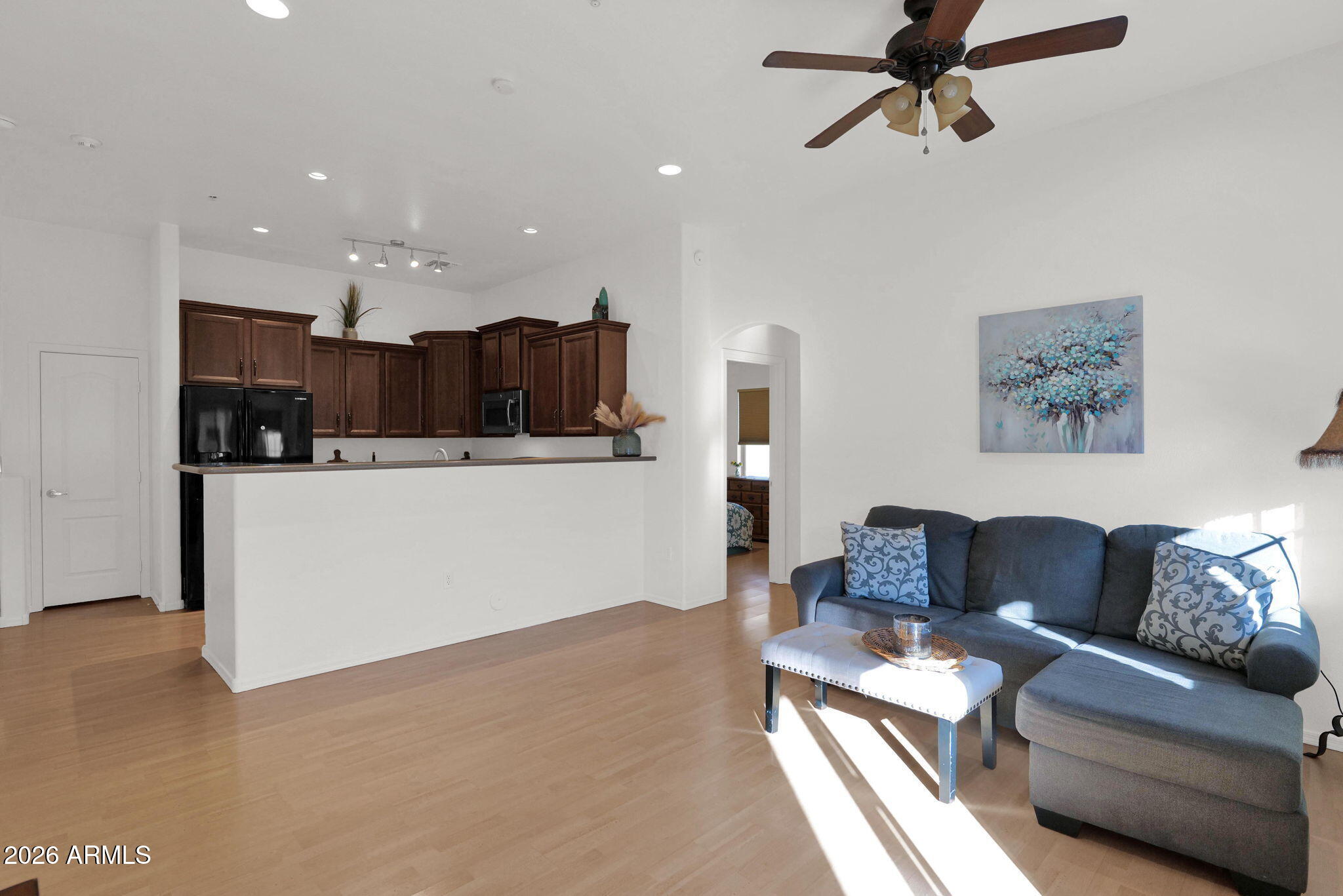 2402 East 5th Street, Unit 1646 Tempe, AZ 85288 - Photo 6 of 37 a living room with furniture and kitchen view