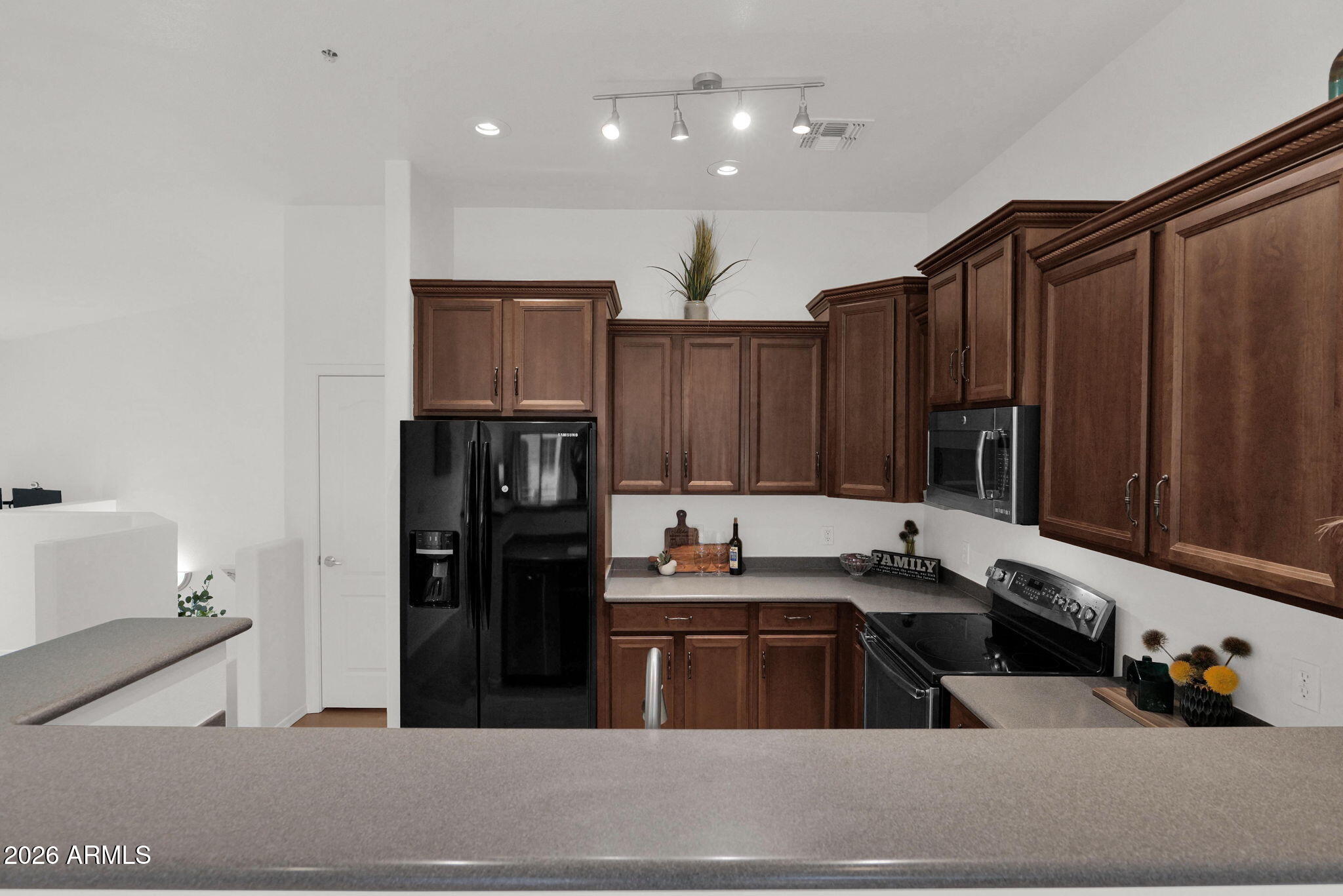 2402 East 5th Street, Unit 1646 Tempe, AZ 85288 - Photo 7 of 37 a kitchen with a sink and cabinets