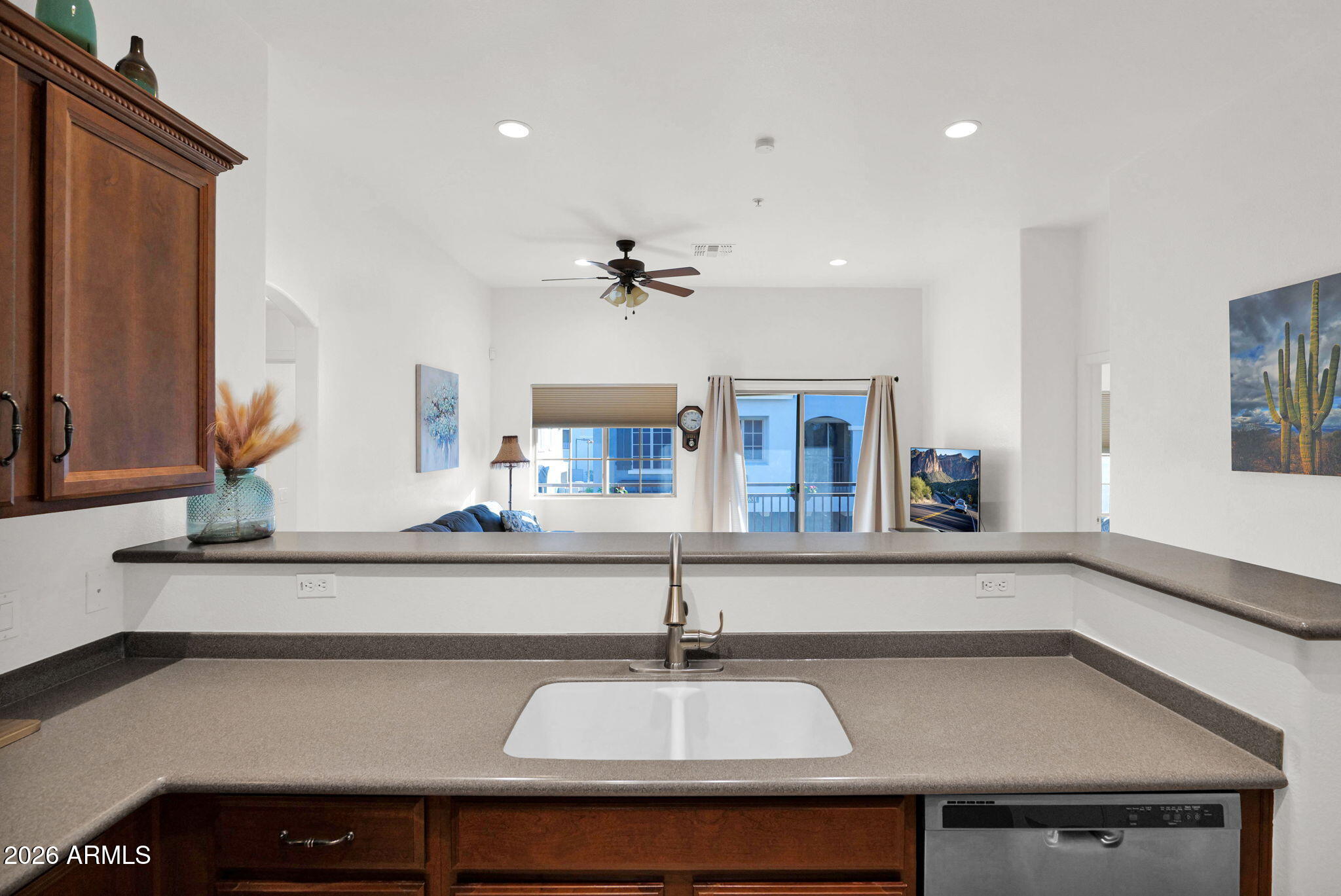 2402 East 5th Street, Unit 1646 Tempe, AZ 85288 - Photo 8 of 37 a kitchen with a sink and a mirror