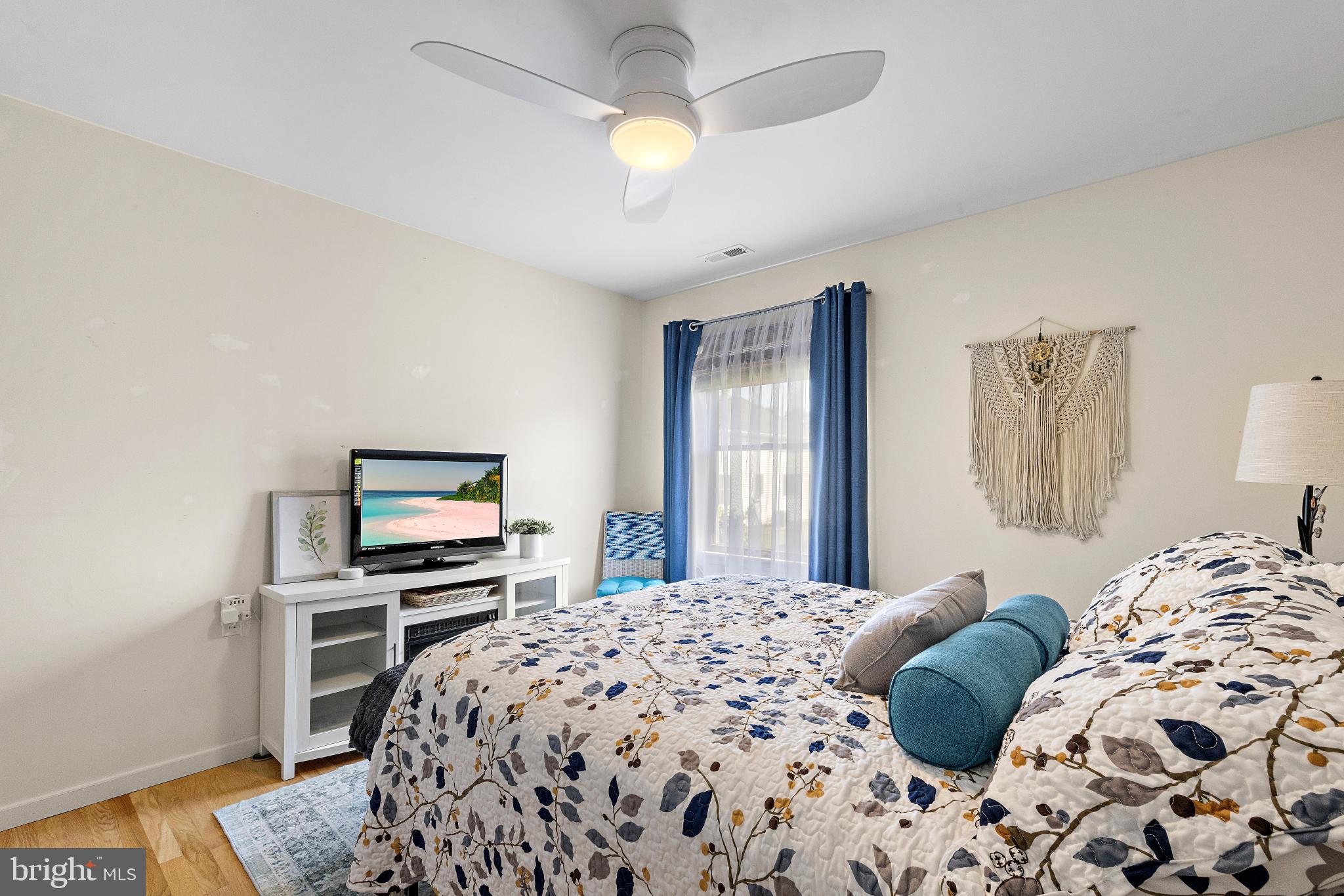 37 Fir Road Manahawkin, NJ 08050 - Photo 22 of 40 a bedroom with a bed and a dresser with rug