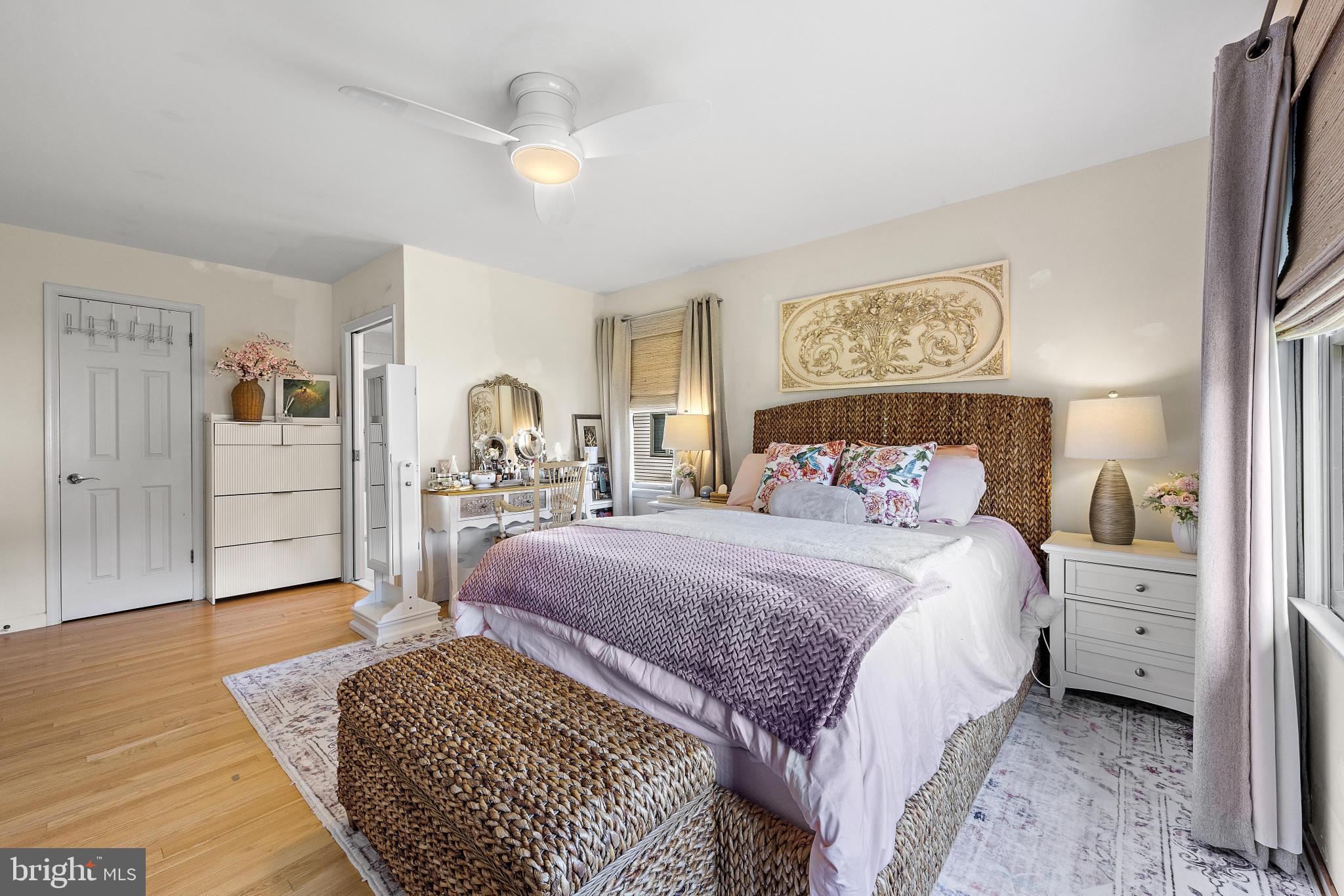 37 Fir Road Manahawkin, NJ 08050 - Photo 24 of 40 a bedroom with a bed lamps and wooden floor