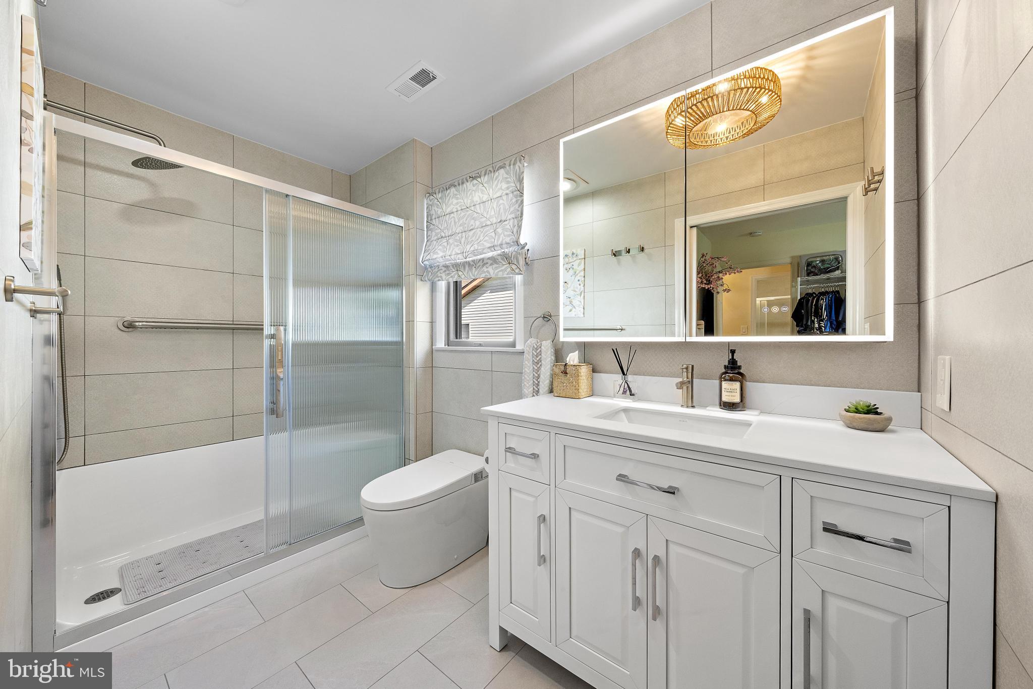37 Fir Road Manahawkin, NJ 08050 - Photo 25 of 40 a bathroom with a granite countertop sink a toilet a mirror and shower
