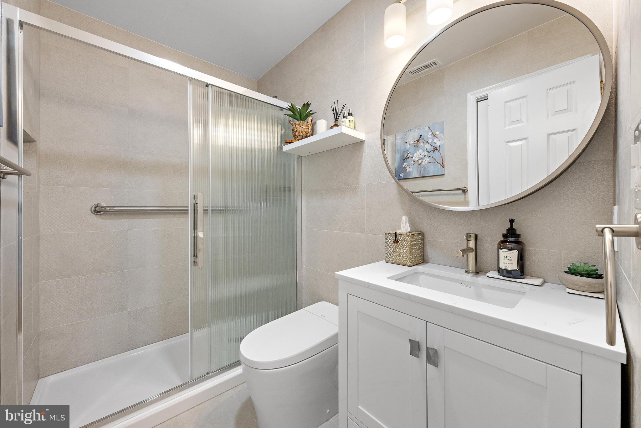 37 Fir Road Manahawkin, NJ 08050 - Photo 27 of 40 a bathroom with a sink and a mirror