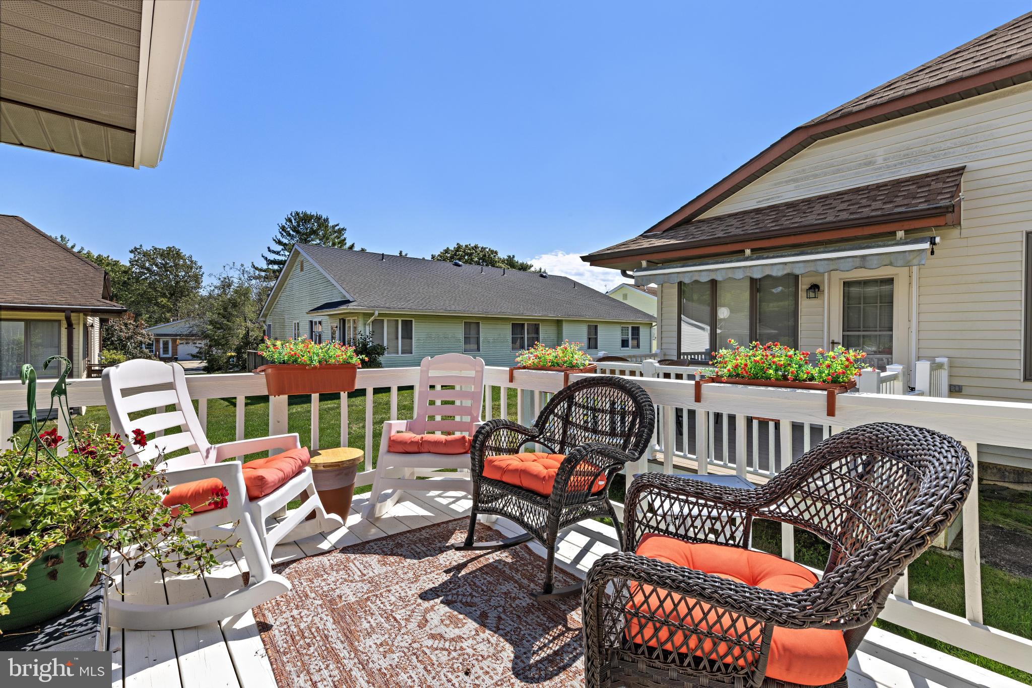 37 Fir Road Manahawkin, NJ 08050 - Photo 31 of 40 a view of a patio with a table chairs and a barbeque