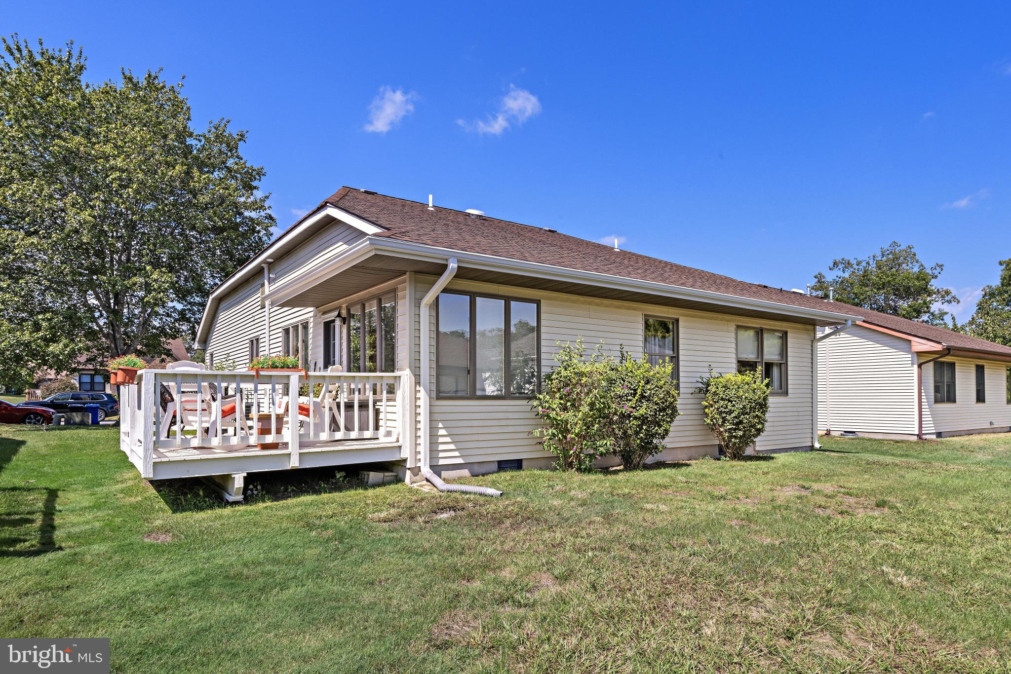37 Fir Road Manahawkin, NJ 08050 - Photo 32 of 40 a front view of a house with garden