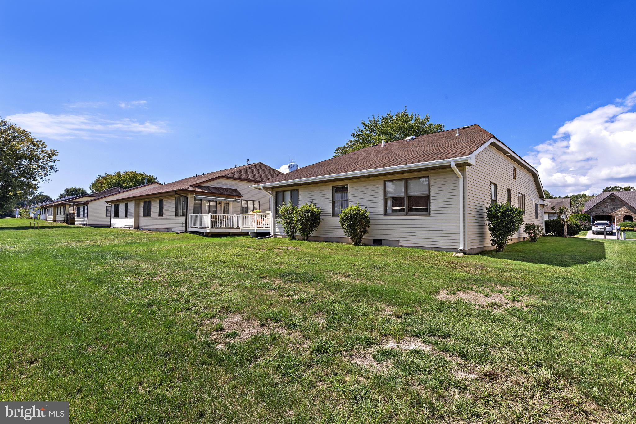 37 Fir Road Manahawkin, NJ 08050 - Photo 33 of 40 a front view of a house with a garden