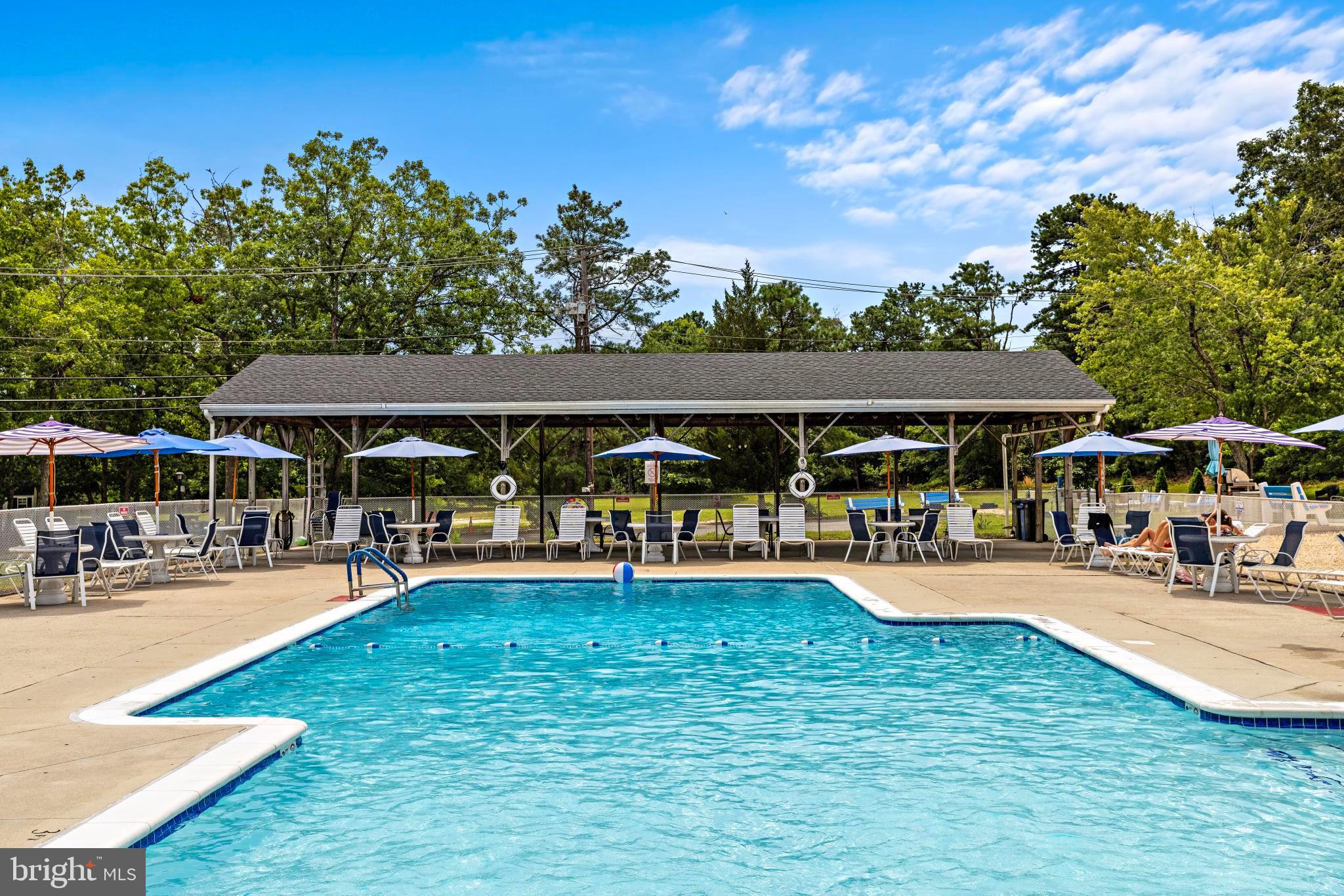 37 Fir Road Manahawkin, NJ 08050 - Photo 37 of 40 a view of a swimming pool with a patio