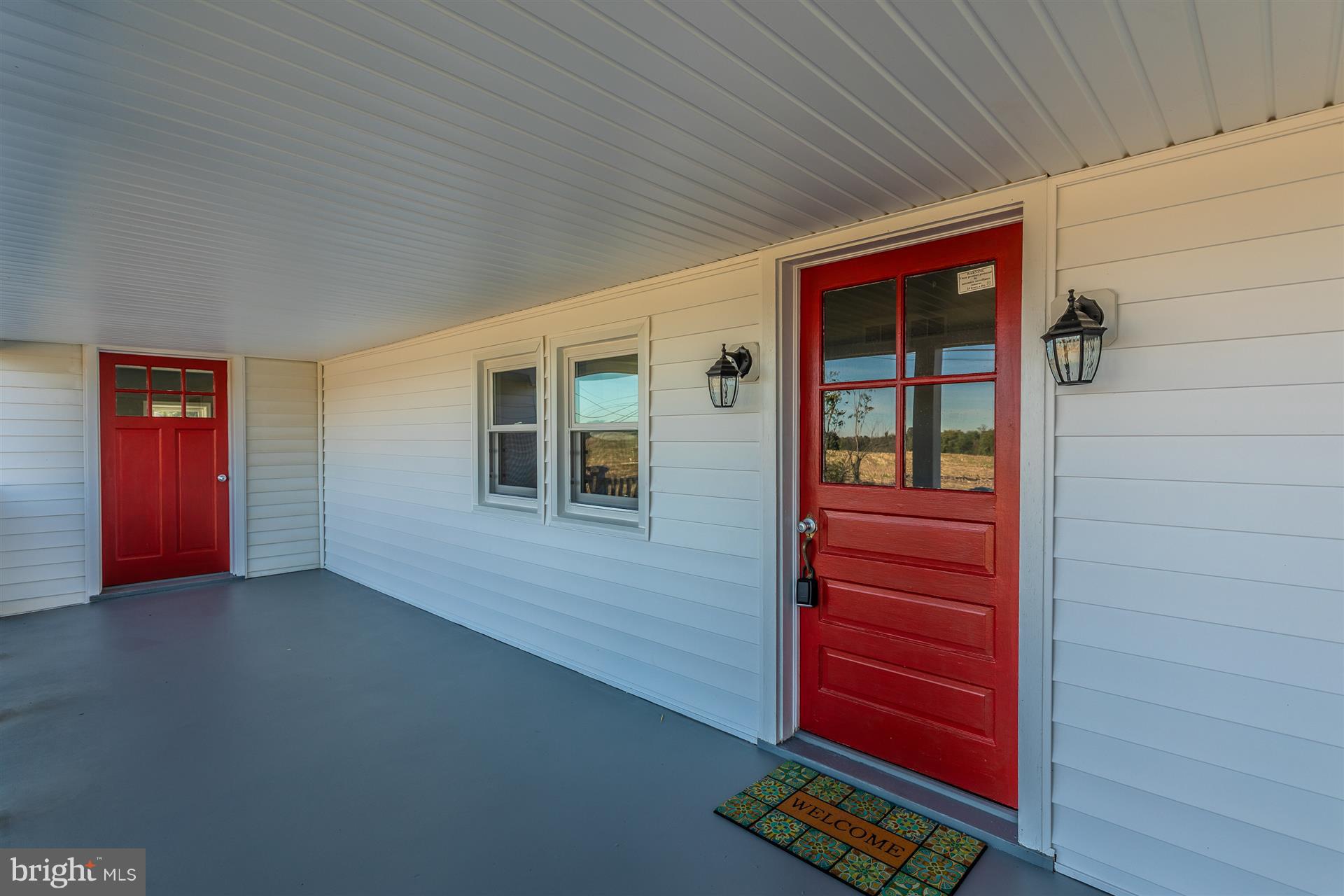 10133 Rocky Ridge Road Rocky Ridge, MD 21778 - Photo 3 of 36 Large porch with two entries.
