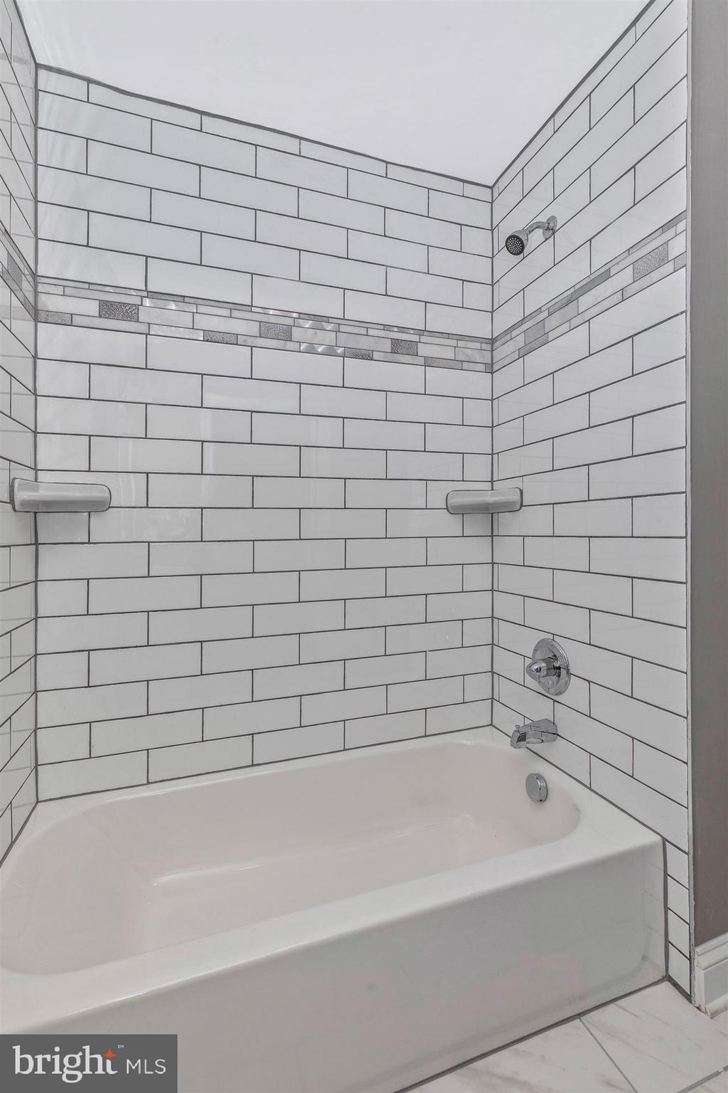 10133 Rocky Ridge Road Rocky Ridge, MD 21778 - Photo 21 of 36 Beautiful subway tile with accent.