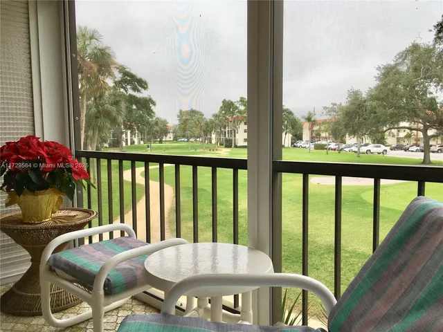 a view of balcony with furniture