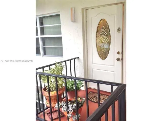 a front view of a house with a wooden floor