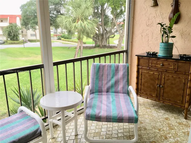 a view of balcony with furniture