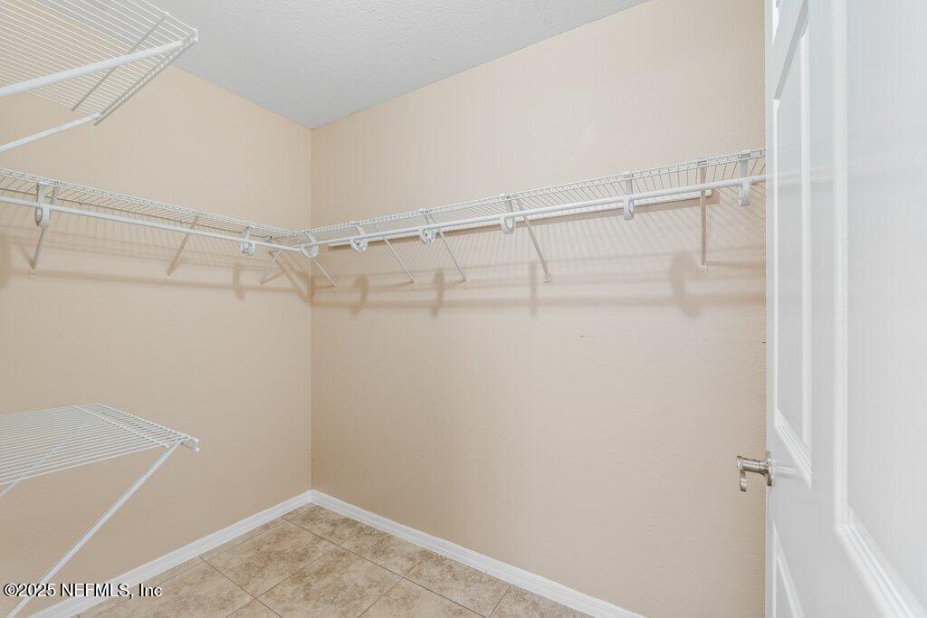 10150 Belle Rive Boulevard, Unit 303 Jacksonville, FL 32256 - Photo 9 of 23 a view of a room with racks on the wall