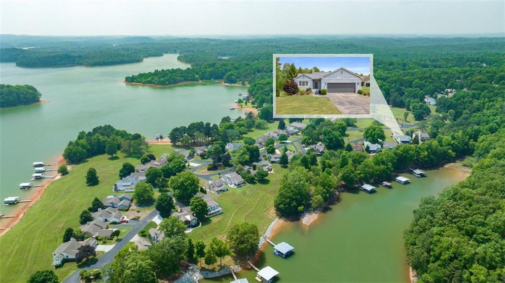 3646 North River Road Gainesville, GA 30506 - Photo 1 of 1 an aerial view of a house with a yard and lake view
