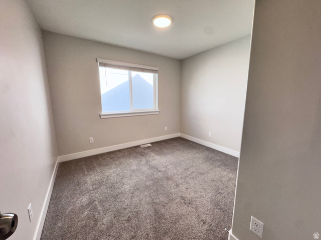 12339 Remy Road, Unit 422 Herriman, UT 84096 - Photo 7 of 36 Spare room with carpet floors and baseboards