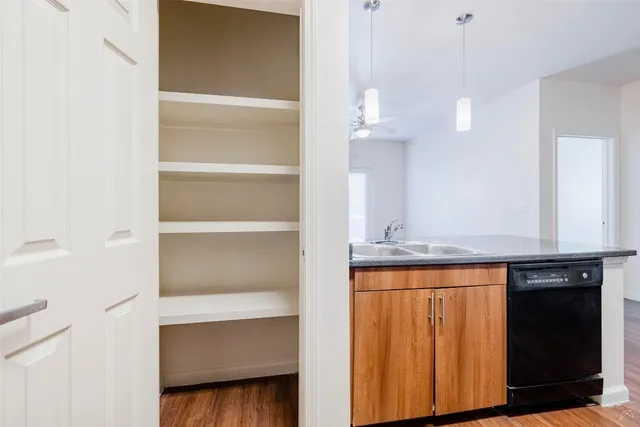a kitchen with a sink and a refrigerator