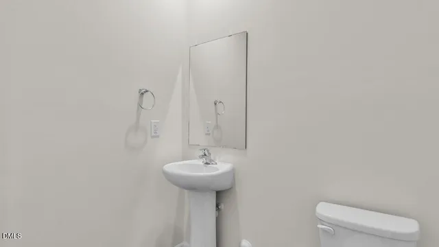 a view of a room that has wooden floor and window