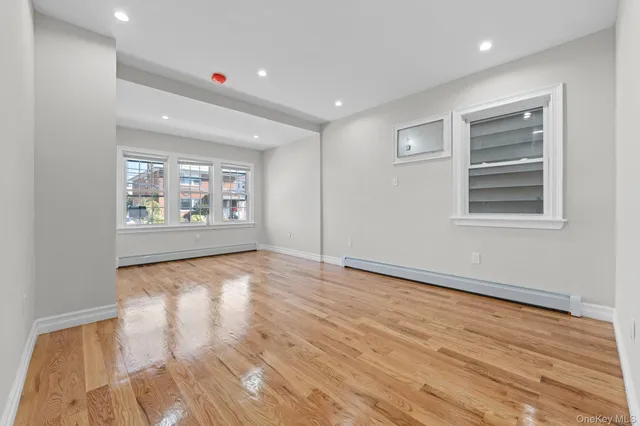 a view of an empty room and a window