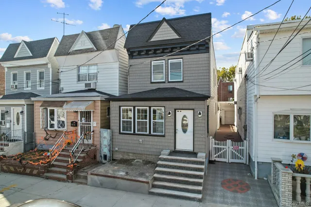 a front view of a house with stairs