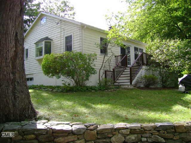 15 Clearview Terrace Ridgefield, CT 06877 - Photo 1 of 1 a front view of a house with a garden