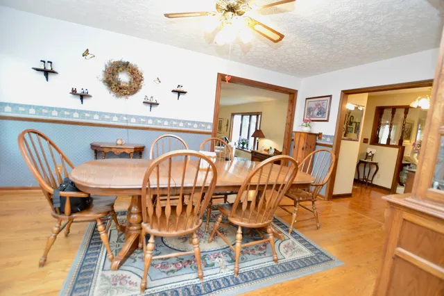 a dining room with furniture and wooden floor