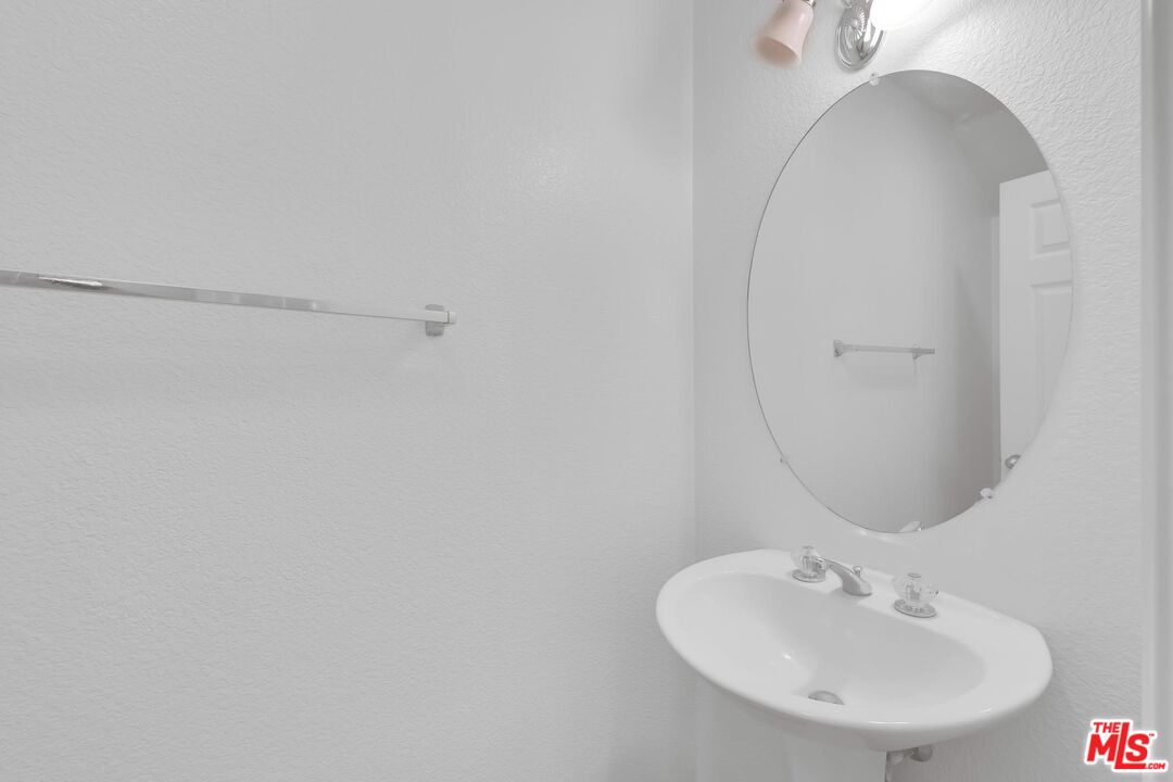 1131 Rosewalk Way Pasadena, CA 91103 - Photo 18 of 42 a bathroom with a sink and a mirror