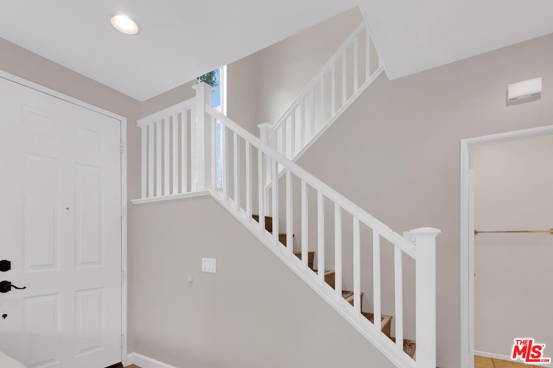 1131 Rosewalk Way Pasadena, CA 91103 - Photo 19 of 42 a view of staircase with railing and white walls