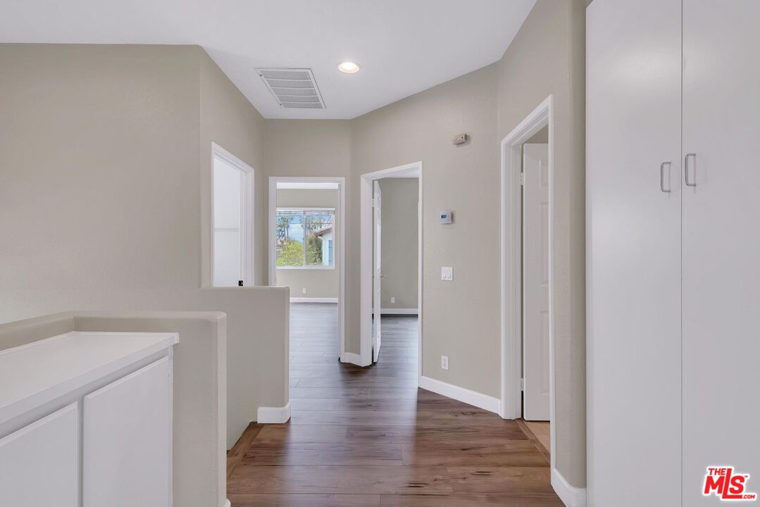 1131 Rosewalk Way Pasadena, CA 91103 - Photo 20 of 42 a view of a hallway with wooden floor