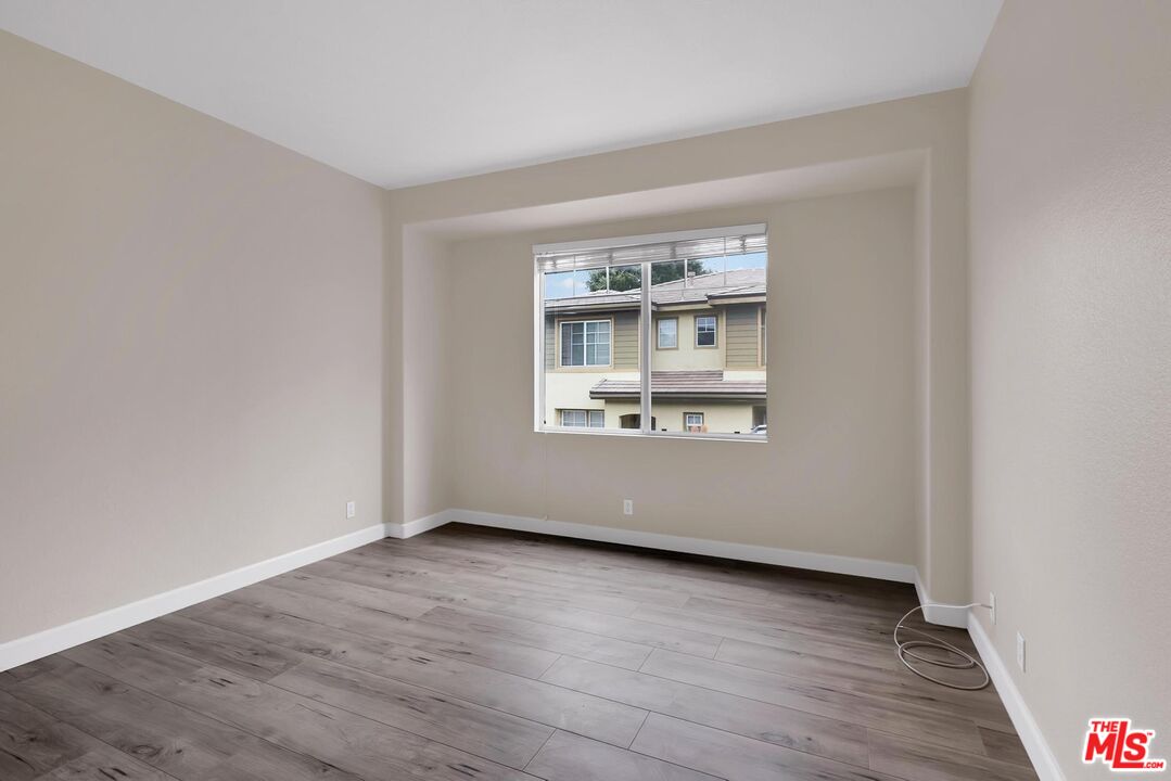 1131 Rosewalk Way Pasadena, CA 91103 - Photo 24 of 42 an empty room with wooden floor and windows