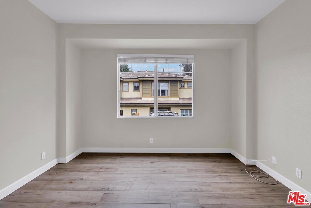 1131 Rosewalk Way Pasadena, CA 91103 - Photo 25 of 42 a view of a room that has wooden floor and window