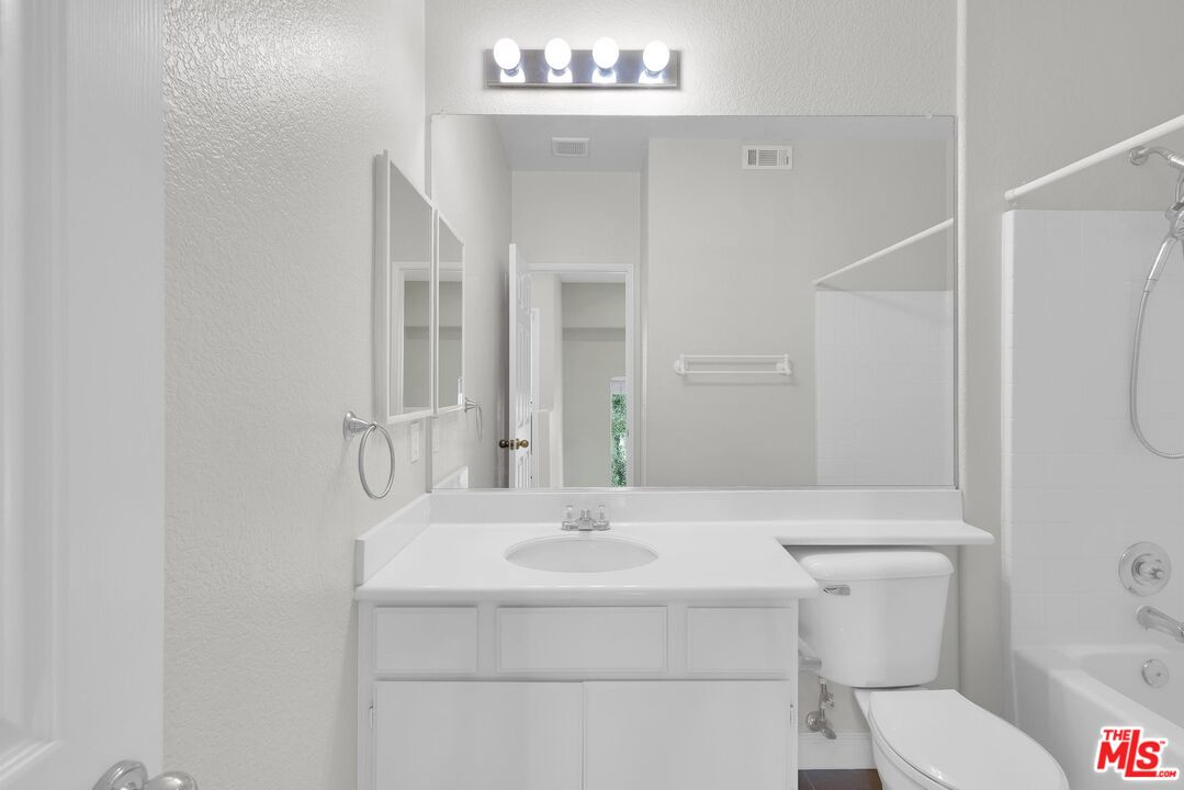 1131 Rosewalk Way Pasadena, CA 91103 - Photo 30 of 42 a bathroom with a sink toilet and shower