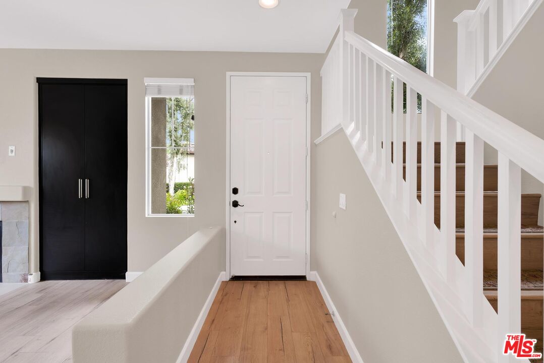 1131 Rosewalk Way Pasadena, CA 91103 - Photo 3 of 42 a view of a hallway with wooden floor and staircase