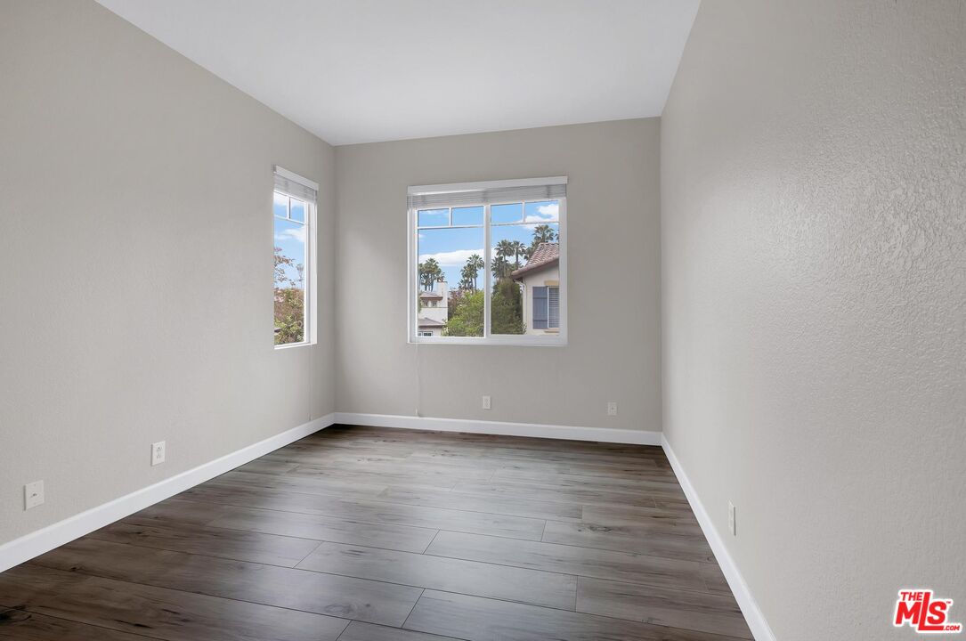 1131 Rosewalk Way Pasadena, CA 91103 - Photo 34 of 42 wooden floor in an empty room with a window