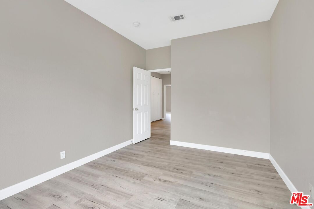1131 Rosewalk Way Pasadena, CA 91103 - Photo 36 of 42 a view of an empty room with wooden floor