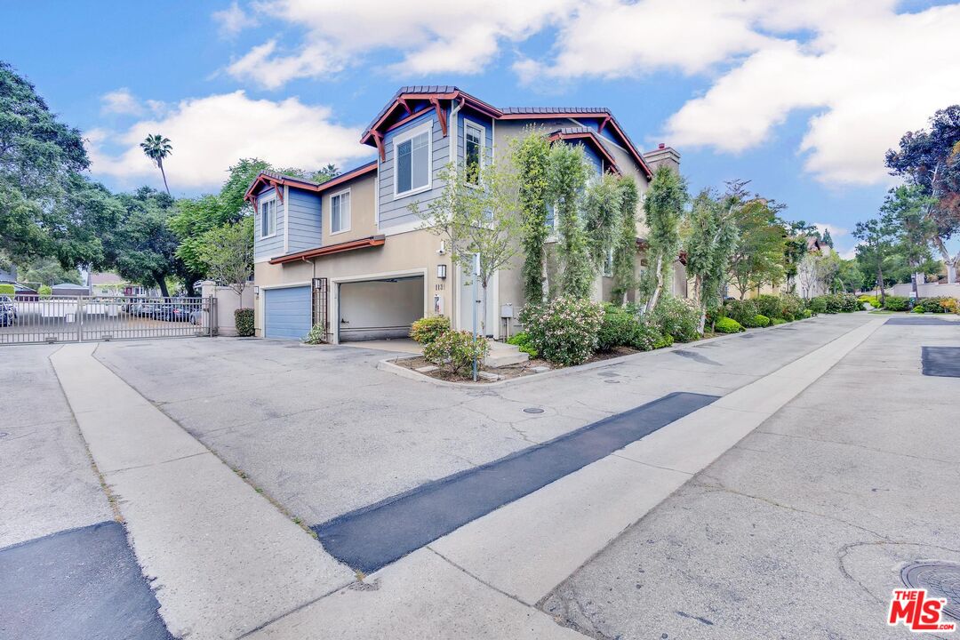 1131 Rosewalk Way Pasadena, CA 91103 - Photo 38 of 42 a view of a house with palm trees
