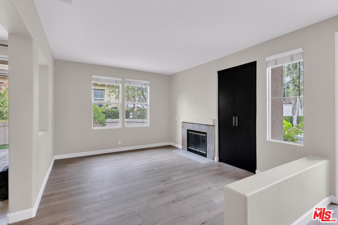 1131 Rosewalk Way Pasadena, CA 91103 - Photo 4 of 42 a view of an empty room with window and wooden floor