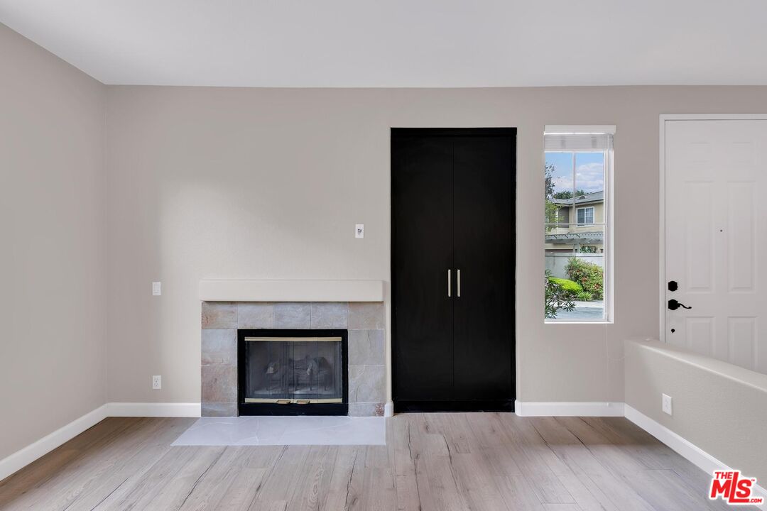 1131 Rosewalk Way Pasadena, CA 91103 - Photo 5 of 42 a view of an empty room with window and wooden floor