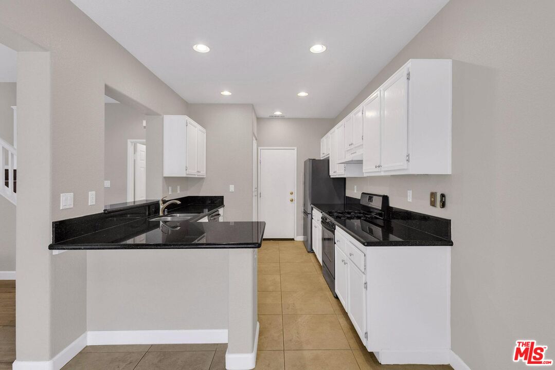 1131 Rosewalk Way Pasadena, CA 91103 - Photo 8 of 42 a kitchen with a sink and cabinets