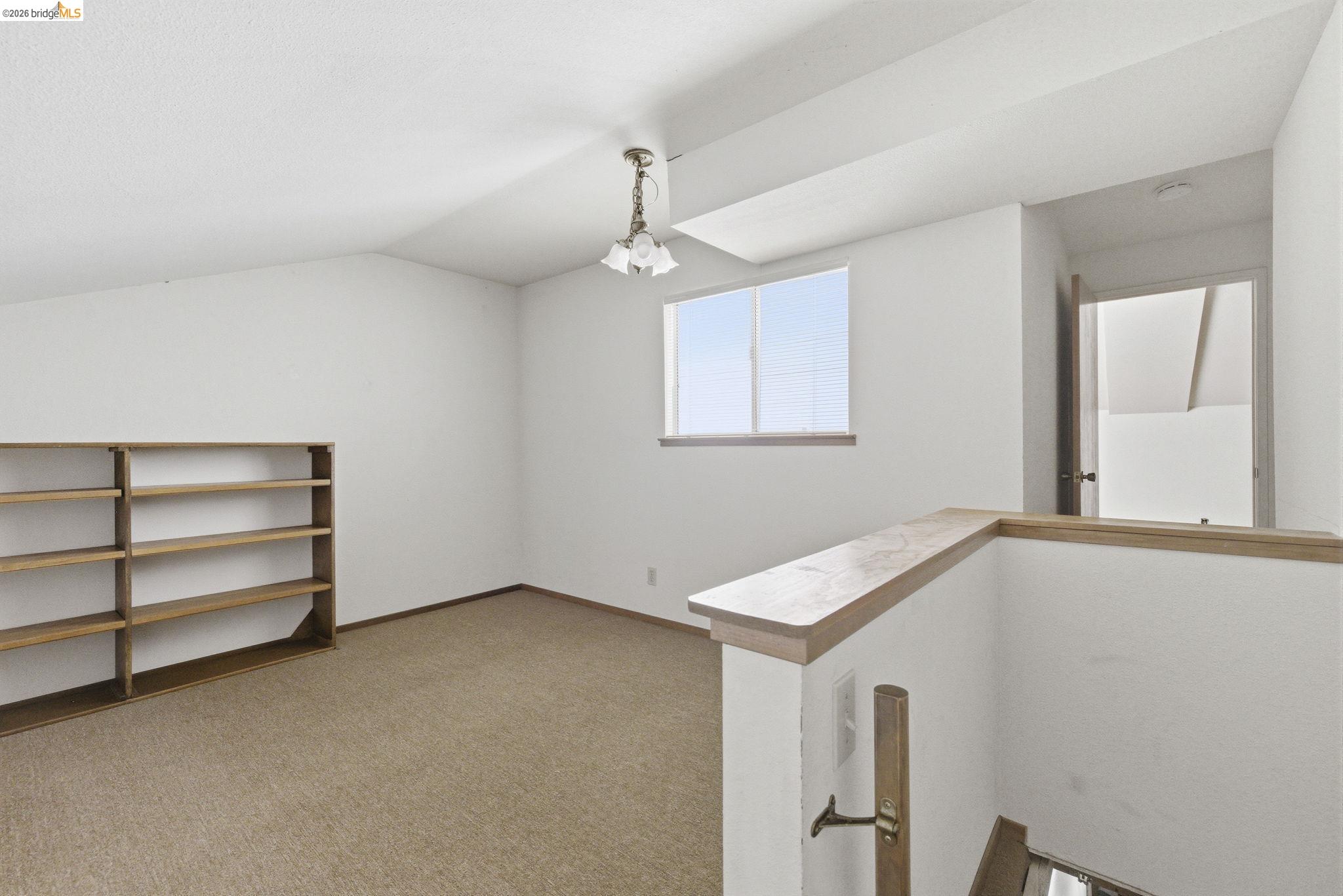 23685 Marble Quarry Road, Unit 8 Columbia, CA 95310 - Photo 11 of 25 a view of an empty room with a window